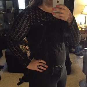 Divided black sheer patterned top